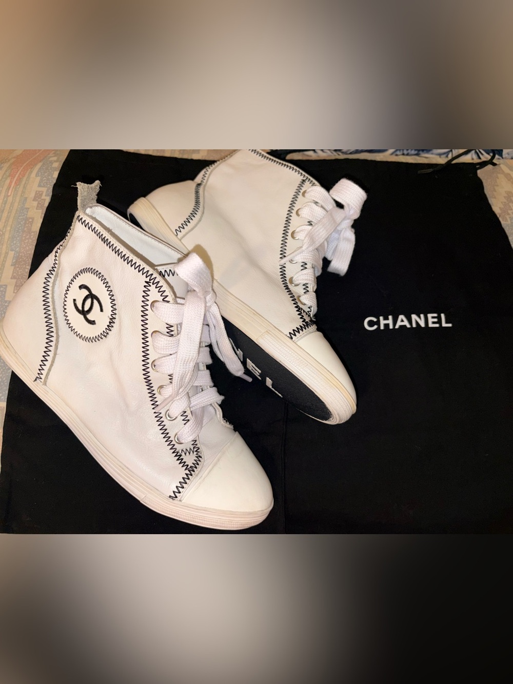 CHANEL White High-Top Leather Sneakers with Black Zigzag Stitch